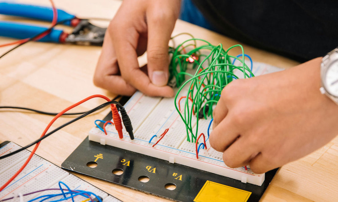 Electrical assembly work on an ASTG control panel at the Newton, New Jersey facility